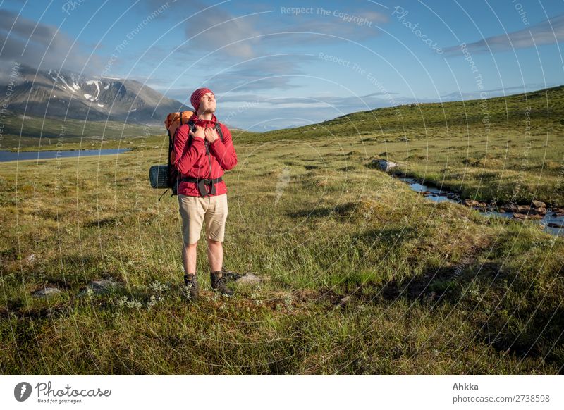 Young man enjoys the sun in the mountains Harmonious Well-being Contentment Senses Relaxation Calm Vacation & Travel Trip Freedom Sunbathing Mountain Hiking