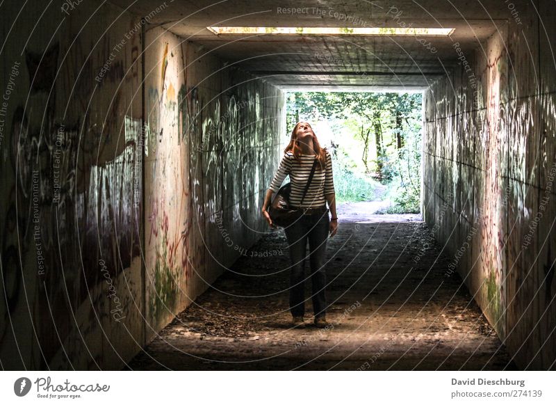 looking up Feminine Young woman Youth (Young adults) Woman Adults Body 18 - 30 years Wall (barrier) Wall (building) Facade Brown Black Tunnel Underpass