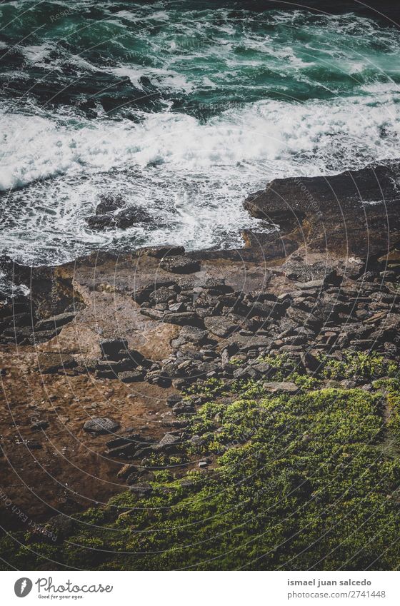 rocks in the sea Cliff Rock Ocean water Coast Beach Nature Exterior shot Vacation & Travel Destination Places Landscape Horizon background Wallpaper Calm Serene