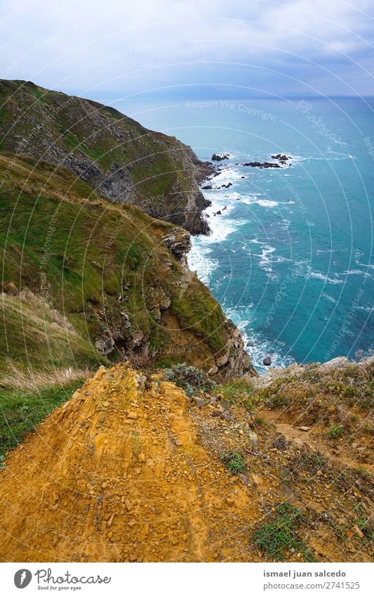 cliff in the coast Cliff Rock Ocean water Coast Beach Nature Exterior shot Vacation & Travel Destination Places Landscape Horizon background Wallpaper Calm