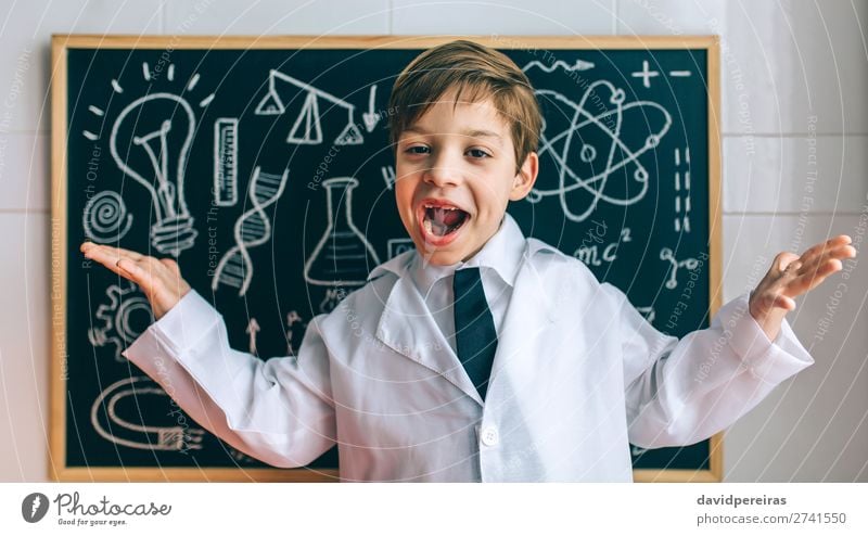 Child dressed as a scientist and chalkboard Happy Science & Research Blackboard Laboratory Human being Boy (child) Man Adults Tie Blonde Authentic Funny Smart