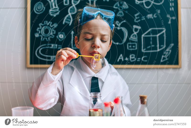 Boy playing with chemistry game blowing bubbles Bottle Playing Science & Research Child School Blackboard Laboratory Human being Boy (child) Man Adults Tie Cute