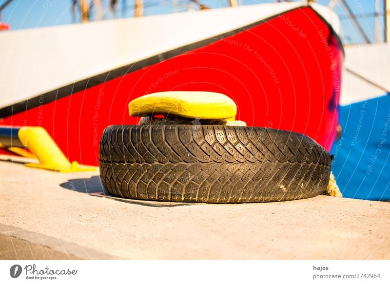 harbour bollard with mooring line and fishing cutter Design Maritime Yellow Bollard Tire mooring rope ship tucked anchored lashed White Blue Harbour Idyll