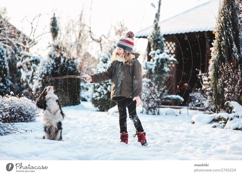 happy child playing with dog in winter Joy Happy Playing Knit Vacation & Travel Winter Snow Garden Child Animal Weather Forest Scarf Hat Pet Dog Drop Smiling