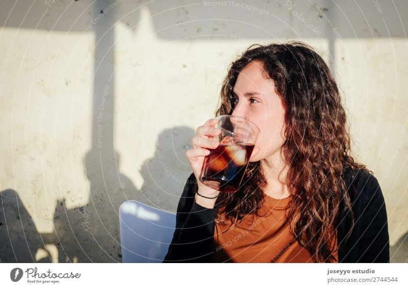 Woman having a drink on a terrace in the sun Alcoholic drinks Lifestyle Joy Happy Beautiful Face Leisure and hobbies Vacation & Travel Summer Sun Table