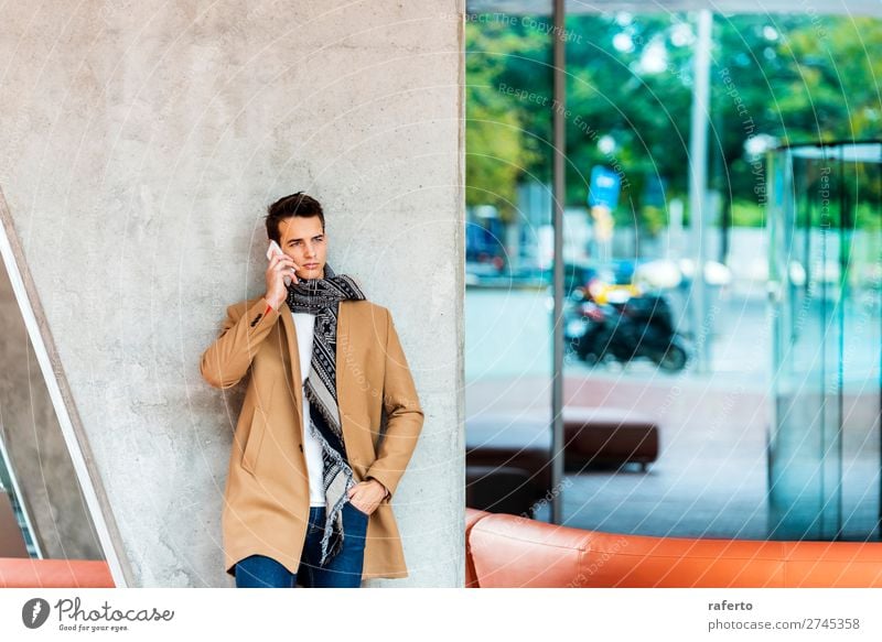 Young man wearing denim clothes using a mobile phone Lifestyle Elegant Style Beautiful Hair and hairstyles To talk Telephone PDA Human being Masculine