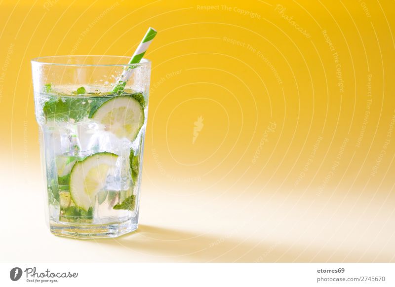 Mojito cocktail in glass on yellow background Cocktail Beverage Drinking Alcoholic drinks Refreshment Summer Lime Green Mint Juice Rum Cold Ice Mixer Fruit