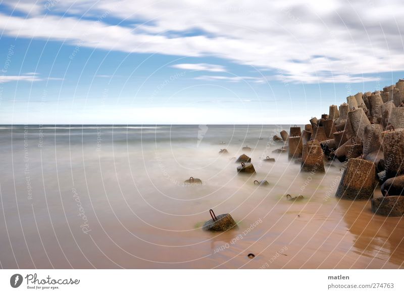 môle Landscape Sand Water Sky Horizon Weather Beautiful weather Ocean Deserted Blue Brown Concrete block Subdued colour Exterior shot Copy Space left Day