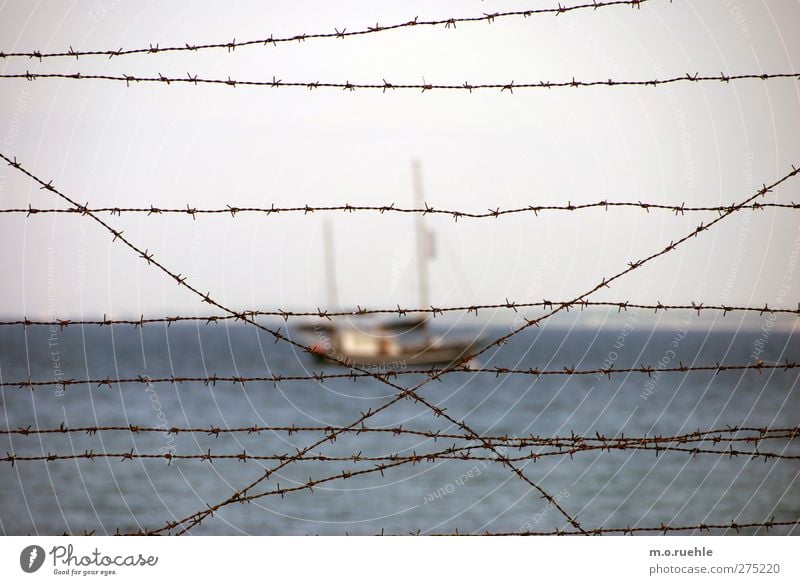 Behind the curtain Vacation & Travel Trip Far-off places Ocean Nature Water Horizon Navigation Sailboat Moody Captured Penitentiary Dinghy Barbed wire