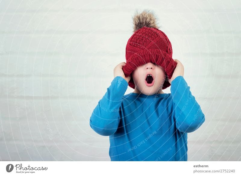 funny child with winter hat on brick background Lifestyle Joy Vacation & Travel Winter Snow Human being Masculine Child Toddler Infancy 1 8 - 13 years Weather