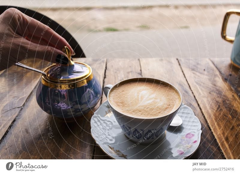 Cappuccino coffee in vintage porcelain cup on the wooden table Food Breakfast Beverage Milk Coffee Latte macchiato Espresso Cup Mug Spoon Lifestyle Shopping