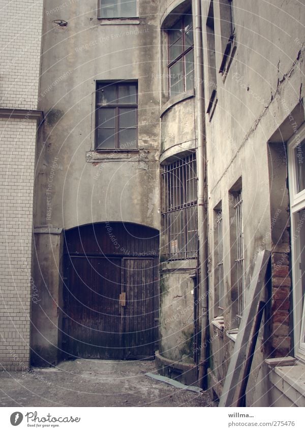 Old backyard Backyard Old building Building Interior courtyard Dirty Dark Gray Decline Transience Change Derelict Tilt window grilles Grating Wooden gate Gloomy