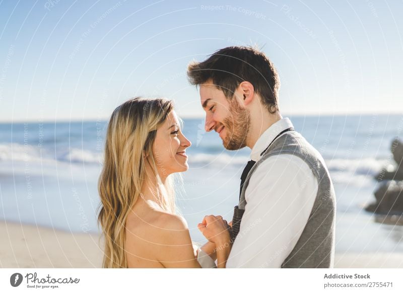 Tender kissing bridal couple in sunlight Couple Wedding Beach Sunlight embracing Engagement Contentment valentine enjoyment in love seascape Stand Relationship