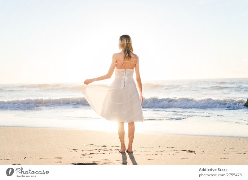 Wonderful tender bride in sunlight Woman Bride Happiness Beach Portrait photograph Cheerful seaside Dress in love seascape Blonde Engagement Sun Expression