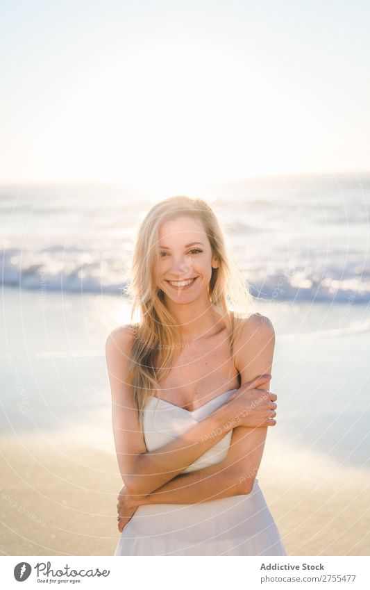 Wonderful tender bride in sunlight Woman Bride Happiness Beach Portrait photograph Cheerful human face seaside Dress in love seascape Blonde Engagement Sun