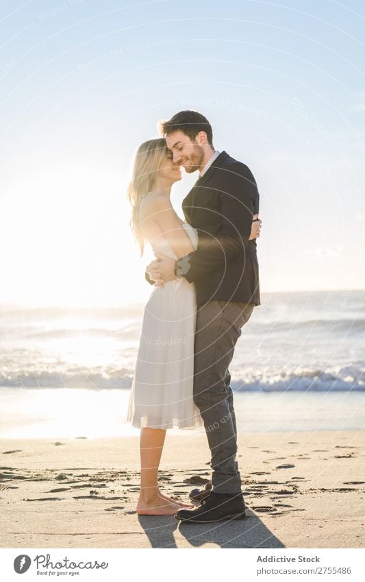 Tender kissing bridal couple in sunlight Couple Wedding Beach Sunlight embracing Engagement Contentment valentine enjoyment in love seascape Stand Relationship