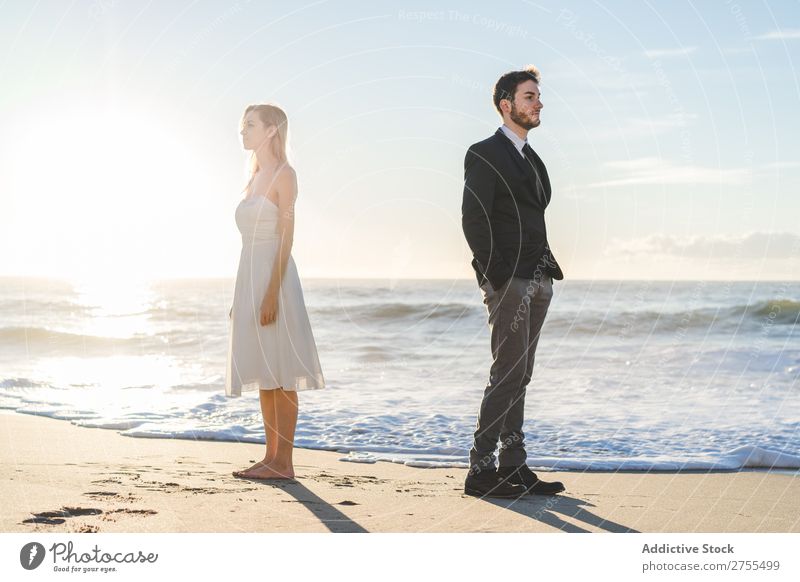 Bridal couple posing on sunny beach Couple Bride Groom Beach dreamers romantic back to back in love Youth (Young adults) Posture Love Together Happiness Style