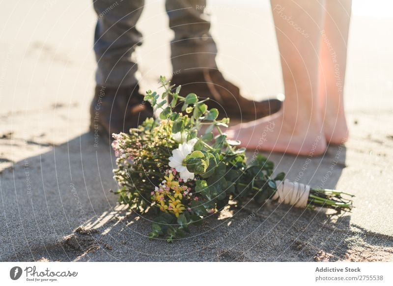 Crop bride and groom on sand Couple Groom Bride Sand Beach Stand Feet in love newlyweds Nature Coast Sunlight Relationship Beauty Photography Barefoot