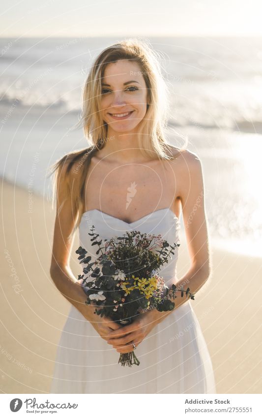 Charming young bride with flowers on beach Woman Bride Bouquet Beach Happiness Portrait photograph Cheerful human face Dress in love Love Elegant Engagement