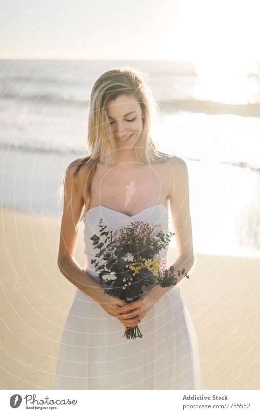 Charming young bride with flowers on beach Woman Bride Bouquet Beach Happiness Portrait photograph Cheerful human face Dress in love Love Elegant Engagement