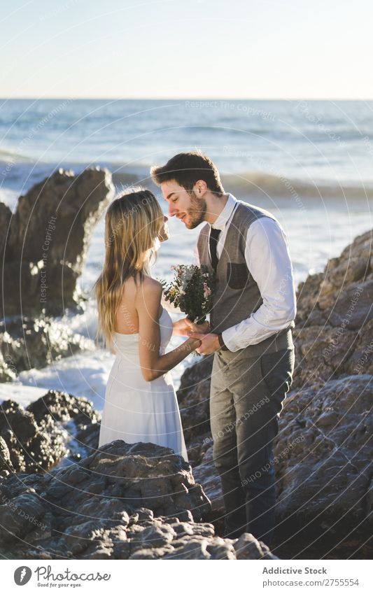 Sensual wedding couple kissing on shoreline Couple bridal Kissing Beach tender in love Wedding Expression romantic Feasts & Celebrations eyes closed Style