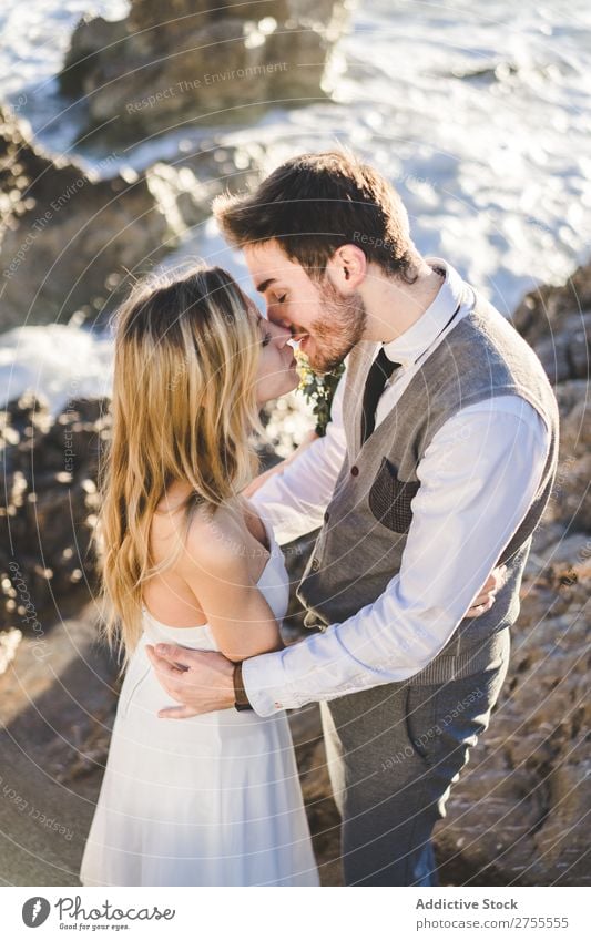 Sensual wedding couple kissing on shoreline Couple bridal Kissing Beach tender in love Wedding Expression romantic Feasts & Celebrations eyes closed Style