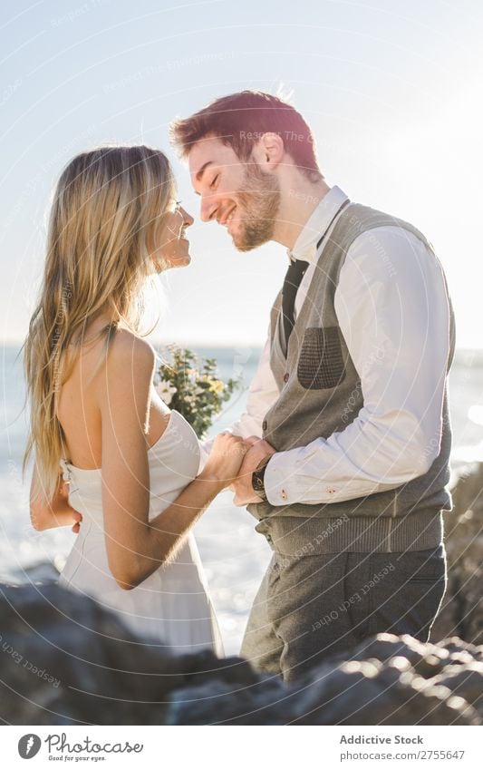 Sensual wedding couple kissing on shoreline Couple bridal Kissing Beach tender in love Wedding Expression romantic Feasts & Celebrations eyes closed Style