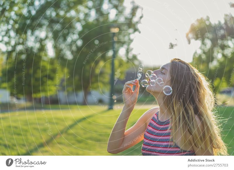 Woman making soap bubbles Park romantic Soap bubble handsome Youth (Young adults) Blow Playful Easygoing Modern Magic Posture Summer Playing Happiness Beautiful