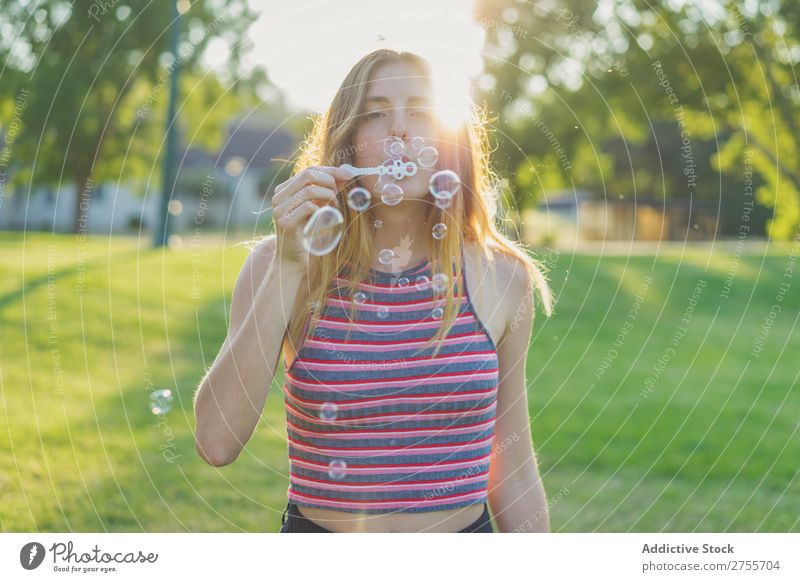 Woman making soap bubbles Park romantic Soap bubble handsome Youth (Young adults) Blow Playful Easygoing Modern Magic Posture Summer Playing Happiness Beautiful