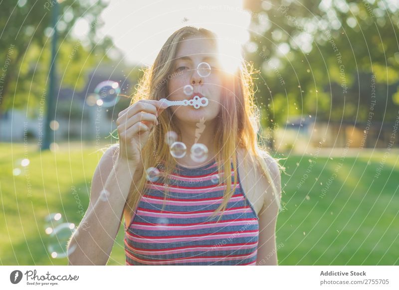 Woman making soap bubbles Park romantic Soap bubble handsome Youth (Young adults) Blow Playful Easygoing Modern Magic Posture Summer Playing Happiness Beautiful