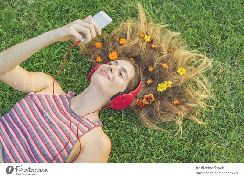 Girl with gadgets on lawn Woman Headphones Relaxation PDA Feminine Music Dream Flower Meadow Entertainment Student Park Summer Freedom Contentment Nature