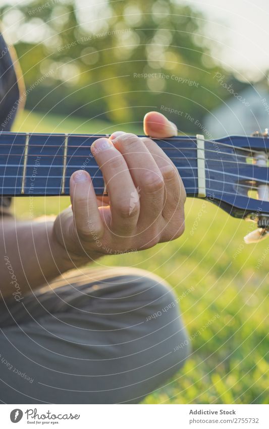 Crop man playing guitar on nature Man Park Guitar Summer Playing Landscape Hipster Musician Dream Nature Lifestyle romantic Vacation & Travel singing Easygoing