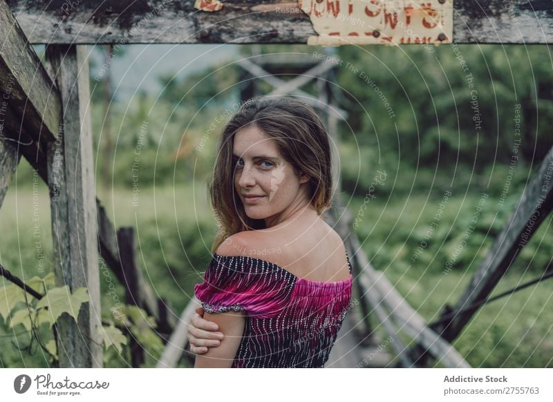 Pretty woman on wooden bridge Woman pretty Posture Nature Wood grungy Bridge Green Sunbeam Day Beautiful Beauty Photography Natural Youth (Young adults)