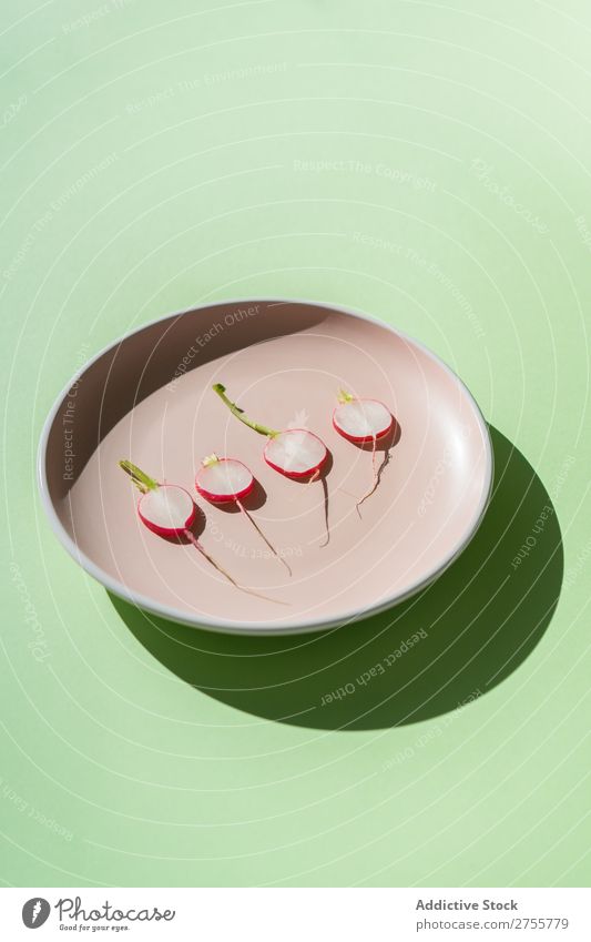 Minimalist composition of radish slices Radish minimalist plates Fresh Organic Nutrition Arrangement Salad geometric Healthy Green Snack Porcelain Diet