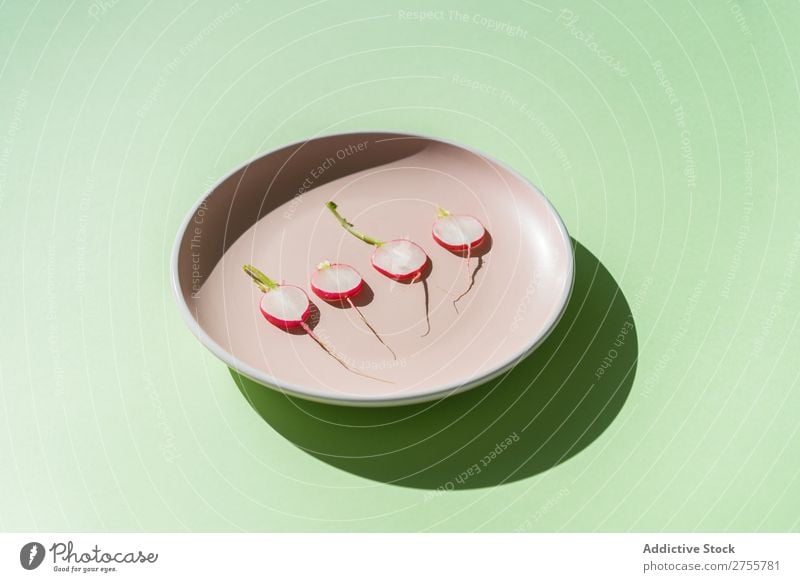 Minimalist composition of radish slices Radish minimalist plates Fresh Organic Nutrition Arrangement Salad geometric Healthy Green Snack Porcelain Diet