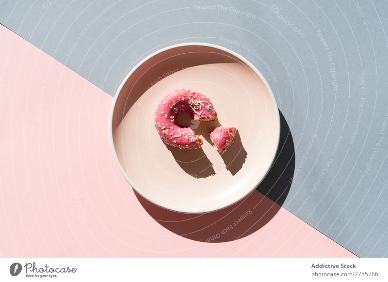 Delicious doughnut on plate composition Donut Multicoloured glazed minimalist geometric Plate Symmetry Confectionary Arrangement Sweet Dessert Colour Pink