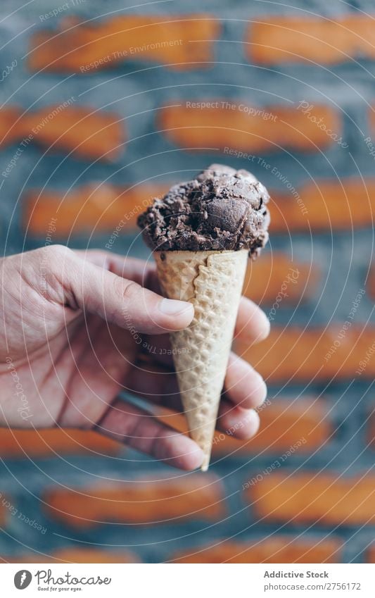 Hand with chocolate ice cream Ice cream Cone Waffle Dessert Chocolate Scoop Sweet Food Cream Cold Summer Delicious Hold yummy Fresh flavor Tasty Brick