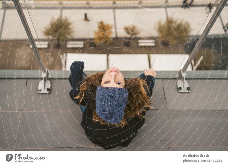 Woman sitting with smartphone at seaside Youth (Young adults) Coast Ocean Provocative Smiling PDA Sit Handrail using pretty Attractive Hat Nature Water