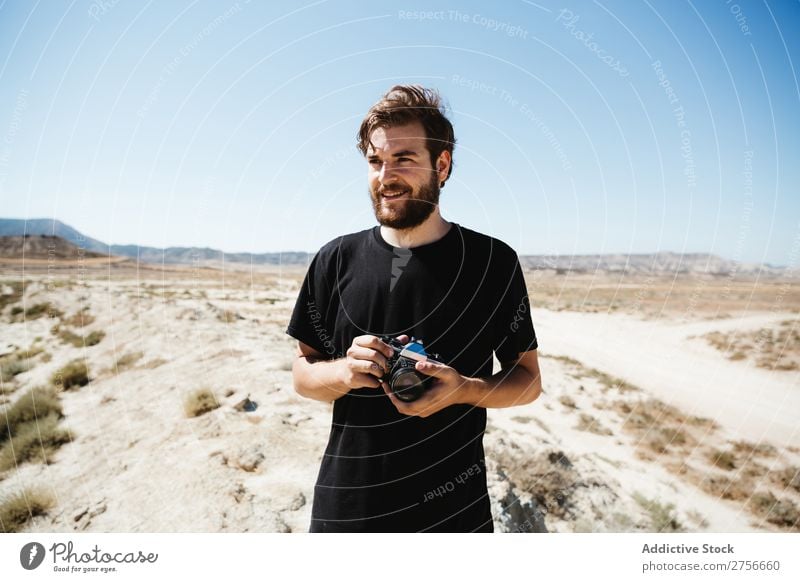 Man with camera on desert Hand Camera Illusion Trick Desert Vacation & Travel Lifestyle Human being Adults Nature Adventure Trip Hot Flying Tourist Landscape