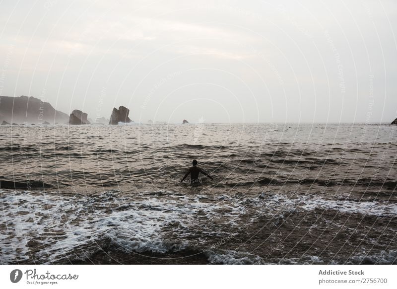 Man bathing on the beach Cliff Ocean Rock Evening Vacation & Travel Tourism Nature Landscape Coast Water Sun Freedom Stone Natural Lifestyle Beautiful