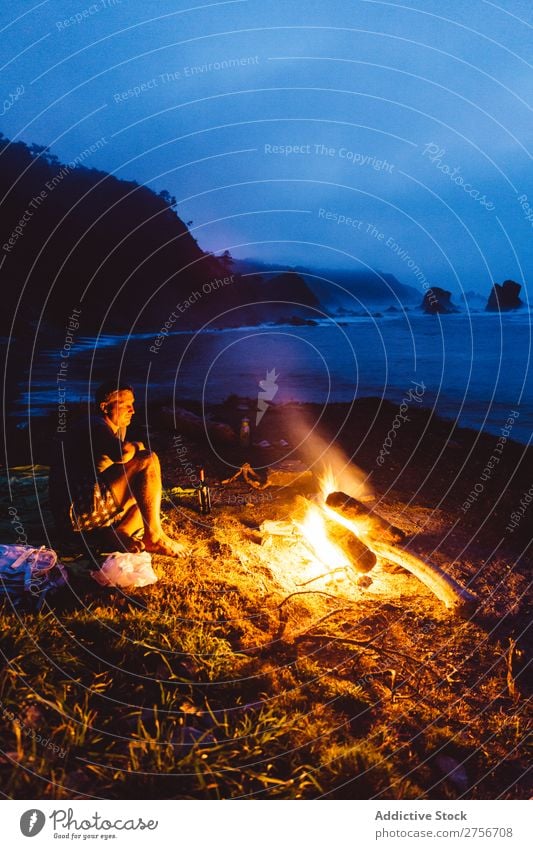 Man near fire on seashore Fire Coast Ocean Nature Evening Night Dark flaming Vacation & Travel Beach Tourism Human being Fireplace Landscape Trip