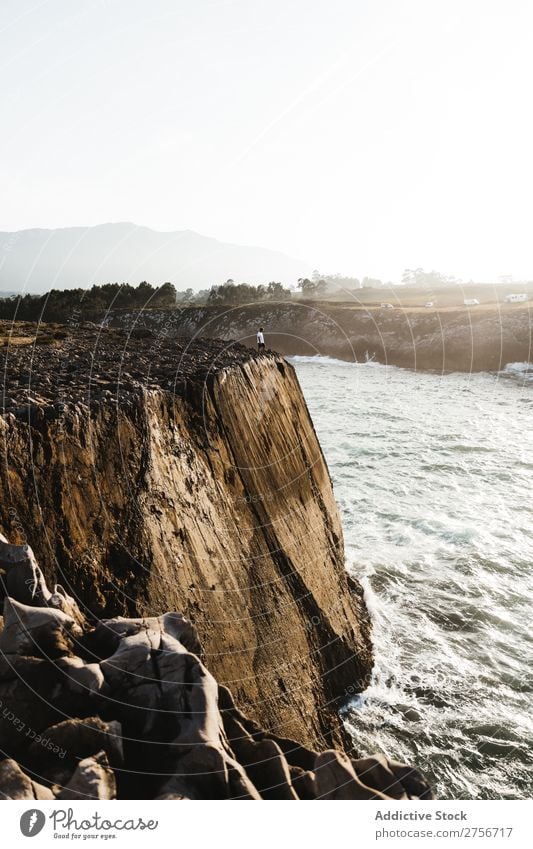 Man standing on cliff Tourist Cliff Rock Vacation & Travel Tourism Nature Landscape Rest Sun Freedom Stone Natural Lifestyle Beautiful Vantage point Human being