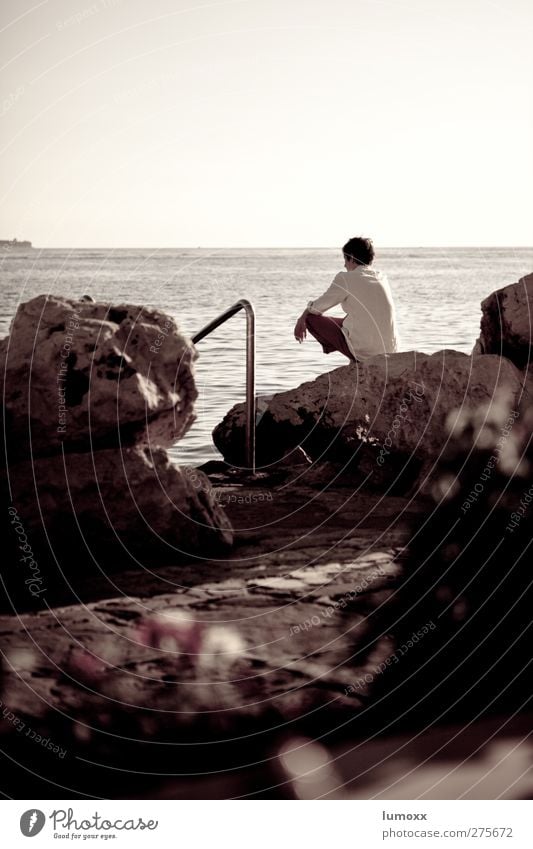 on the rocks Vacation & Travel Far-off places Summer Summer vacation Beach Ocean Human being Masculine Young man Youth (Young adults) Back 1 Water Horizon