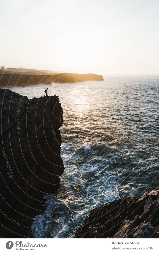 Person on cliff Human being Cliff Ocean Nature Vacation & Travel Sky Rock Stone Coast Bay Vantage point Beautiful Idyll Picturesque Serene Water Peaceful Calm