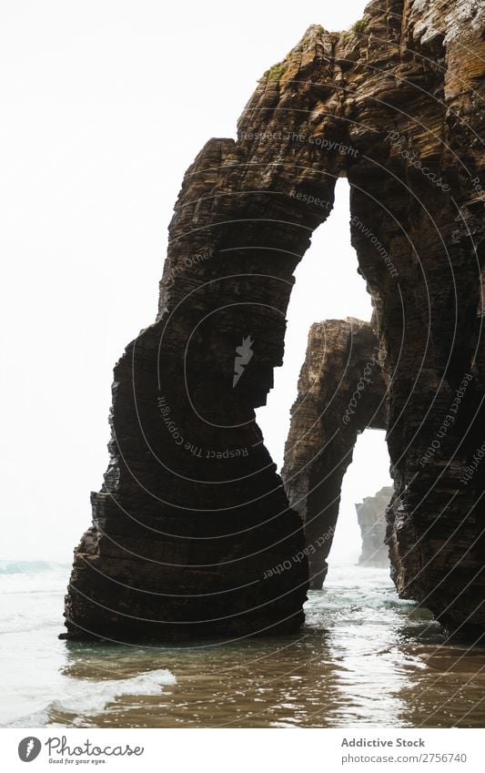 Landscape of caves Cliff Ocean Nature Vacation & Travel Sky Human being Man Rock Stone Coast Bay Vantage point Beautiful Idyll Picturesque Serene Water Peaceful