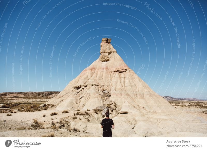 Man posing on the hill of a dune Nature Life Calm tranquil Summer Warmth Heat Beautiful Hot Sunbeam Pollination Dust Day Exterior shot Desert Cliff