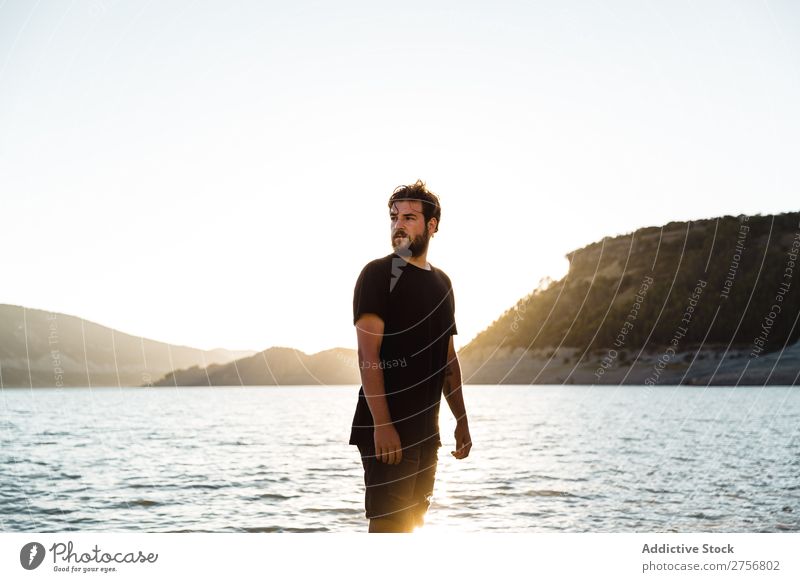 Man posing on beach Water Human being Vacation & Travel Nature Relaxation Ocean Lake Resting Calm tranquil Serene Peaceful Dark Deep Wet Cold enjoying