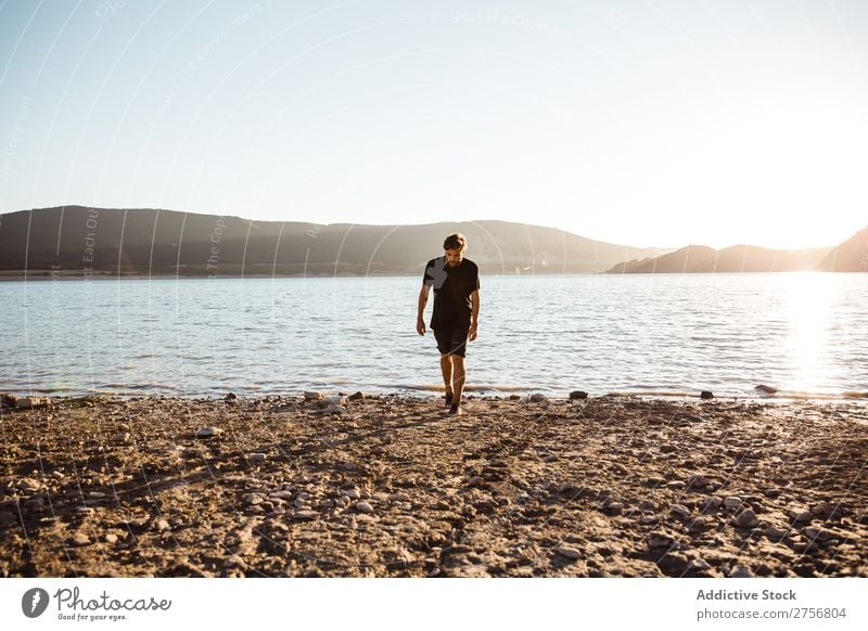 Man posing on beach Water Human being Vacation & Travel Nature Relaxation Ocean Lake Resting Calm tranquil Serene Peaceful Dark Deep Wet Cold enjoying