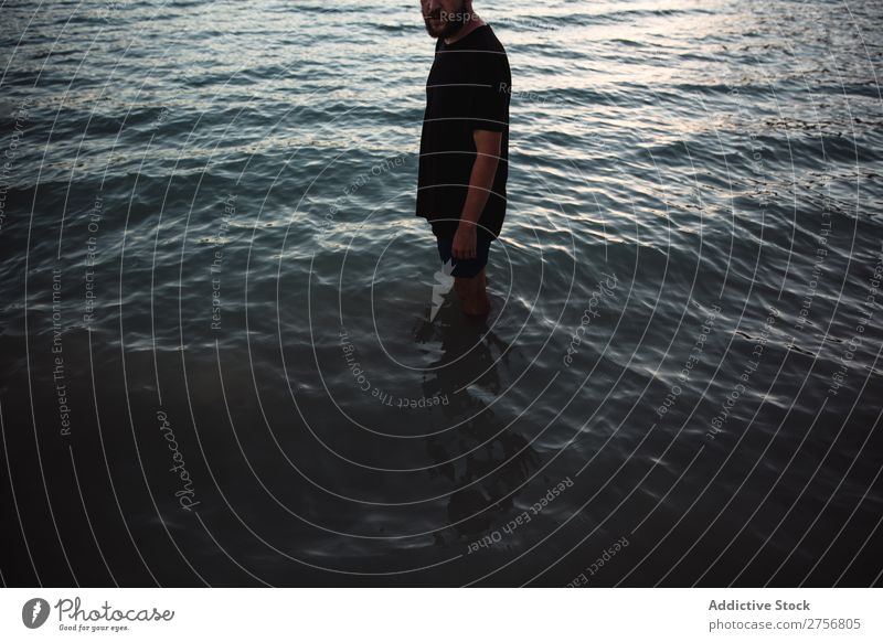 Man standing in water Water knee-deep Human being Vacation & Travel Nature Relaxation Ocean Lake Resting Waves Calm tranquil Serene Peaceful Dark Deep Wet Cold