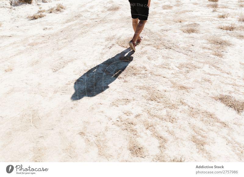 Crop man walking on desert Man Desert Cliff Vacation & Travel Lifestyle Human being Adults Nature Adventure Trip Tourist Sunbeam enjoying Rock Stone Landscape